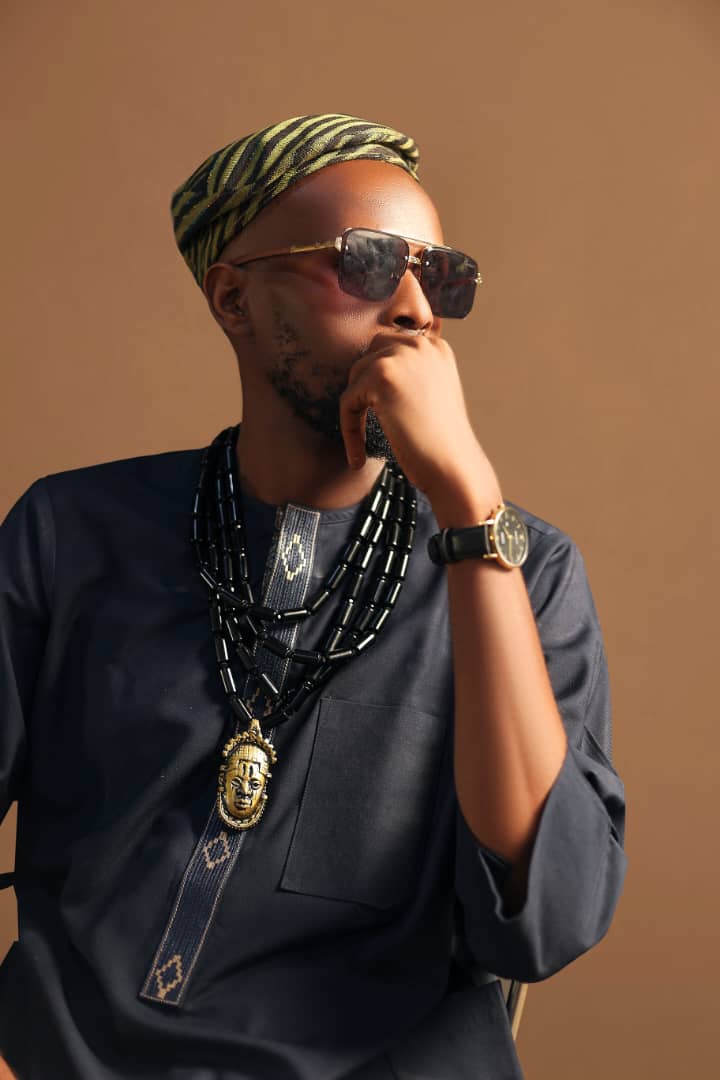 Portrait of a man in traditional attire with sunglasses, photographed by Logical Studios